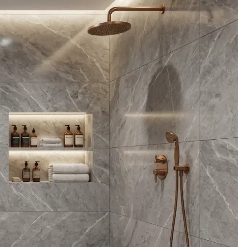 Walk-in shower with copper fittings and stone tiling
